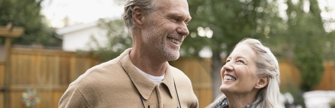 A mature couple enjoying an afternoon in their backyard